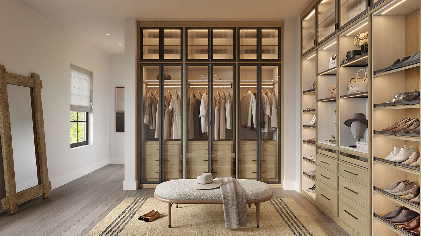 Storage closet for wardrobe with built in cabinets and shelving by California Closets