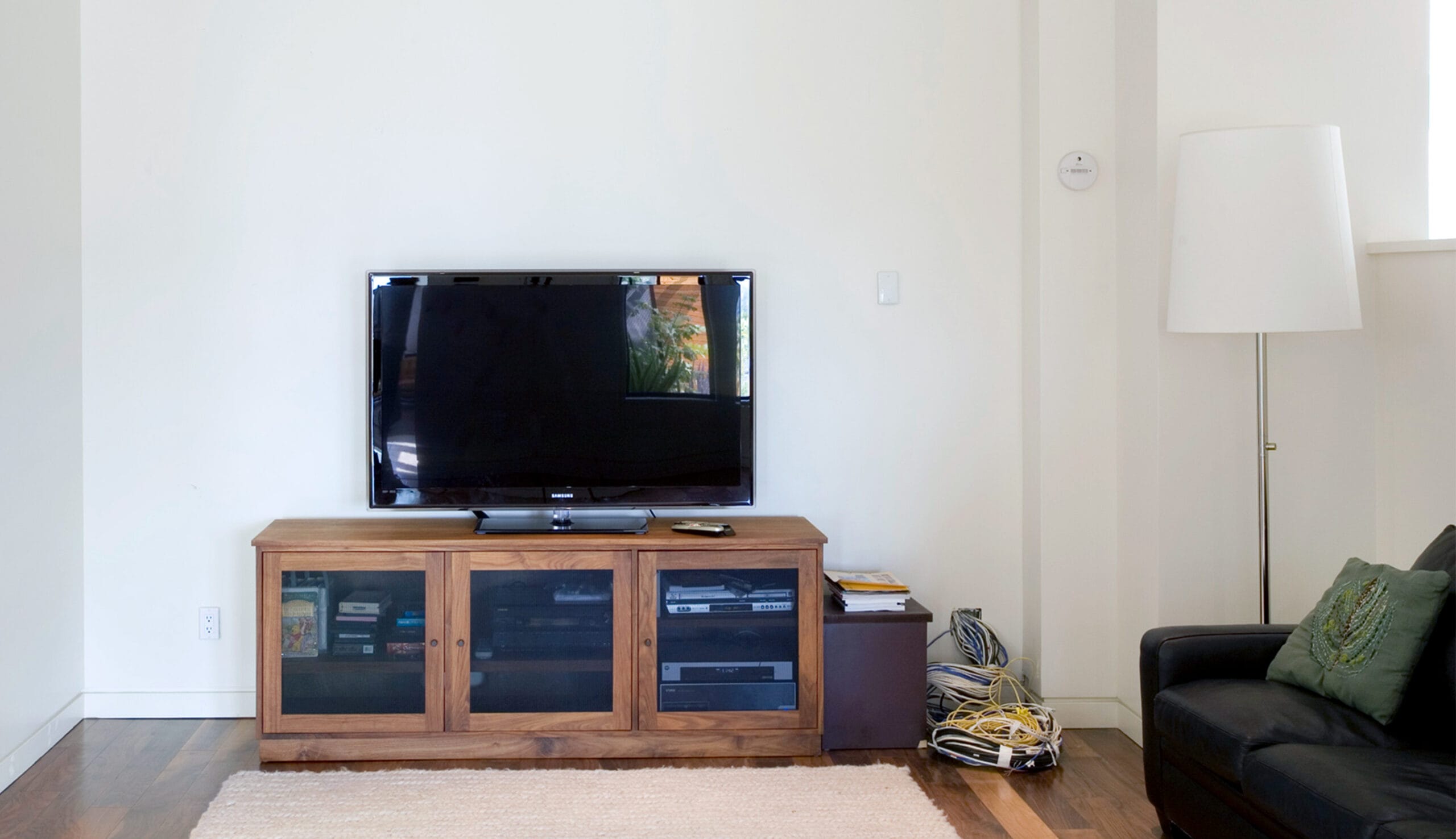 Before renovation of an older media center stnd to get renovated with a wall system solution by California Closets