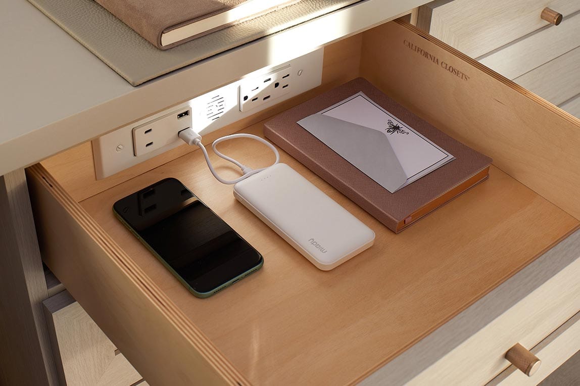Multiple devices chargers in a desk drawer designed by California Closets
