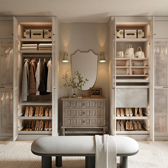 Custom wardrobe walk in closet storage system with vanity and lighting detail by California Closets
