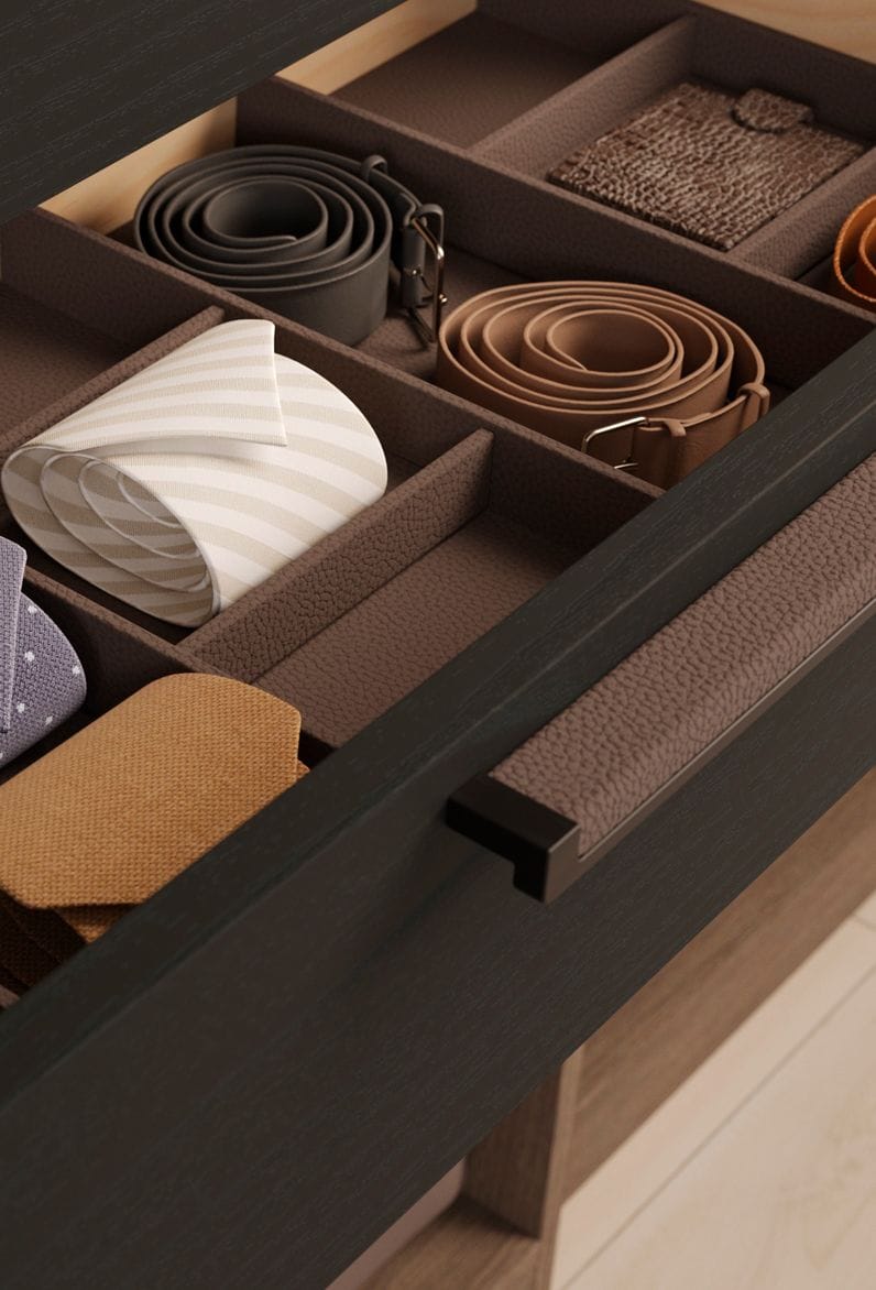 Custom closet drawer designed with inserts to separate ties and belts by California Closets