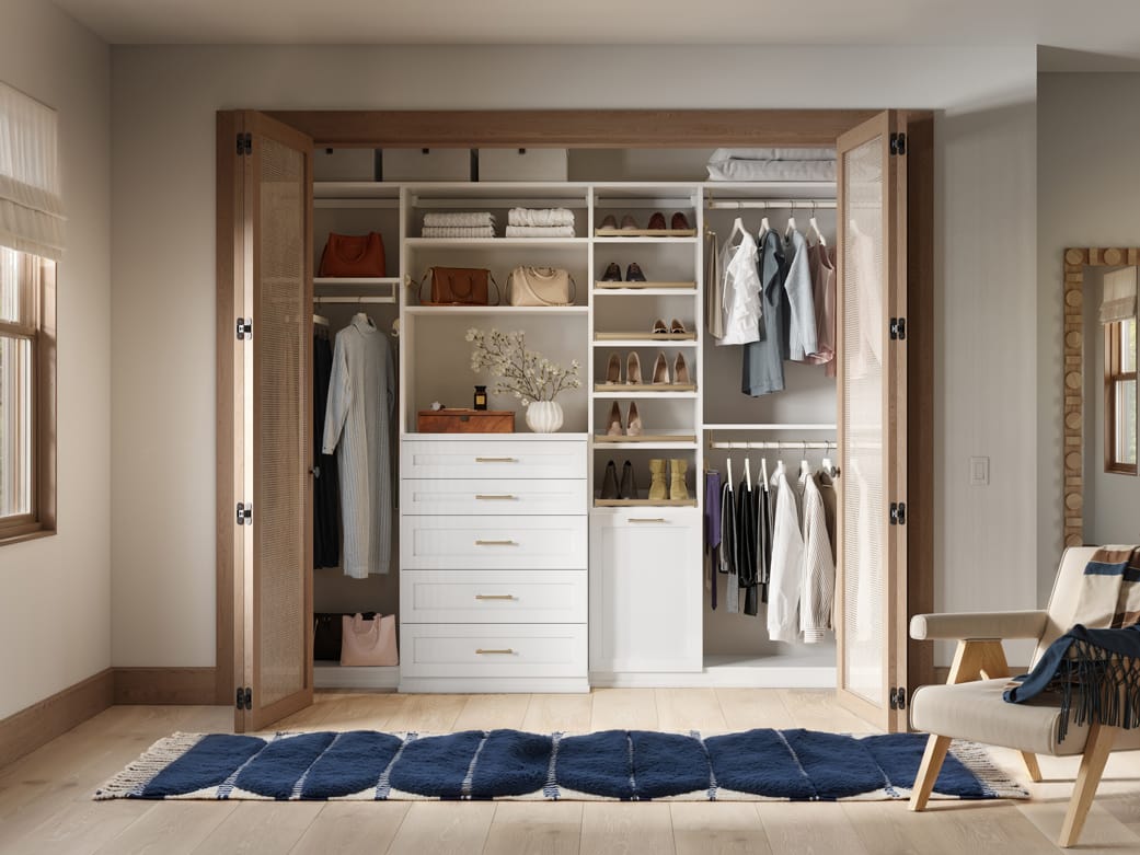 Custom closet system reach in design with custom drawers and built-in dresser drawers by California Closets
