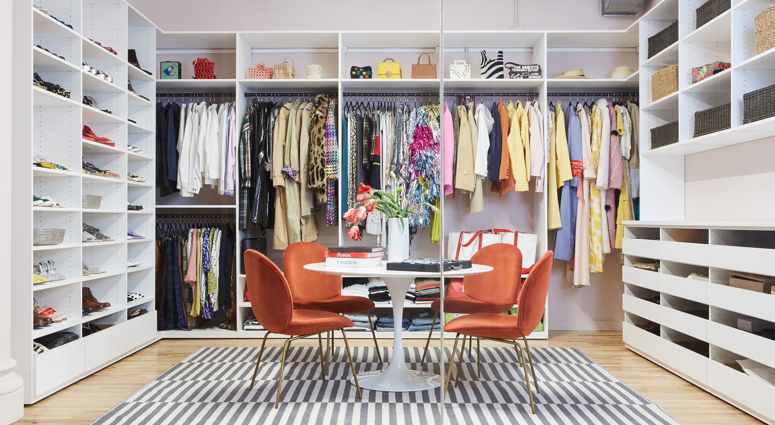 Design for a clothing showroom created with custom clothes rods, shelving system and closet office storage by California Closets